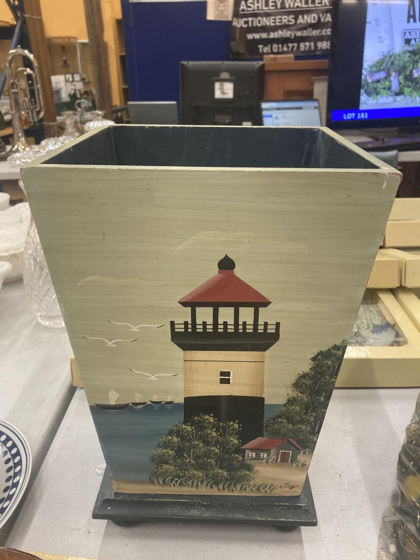 A WOODEN WASTE BIN WITH HAND PAINTED LIGHTHOUSE DESIGN, HEIGHT 34CM