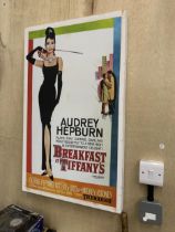 A LARGE CANVAS APPROX 80 X 50 CM OF AUDREY HEPBURN BREAKFAST AT TIFFANY'S
