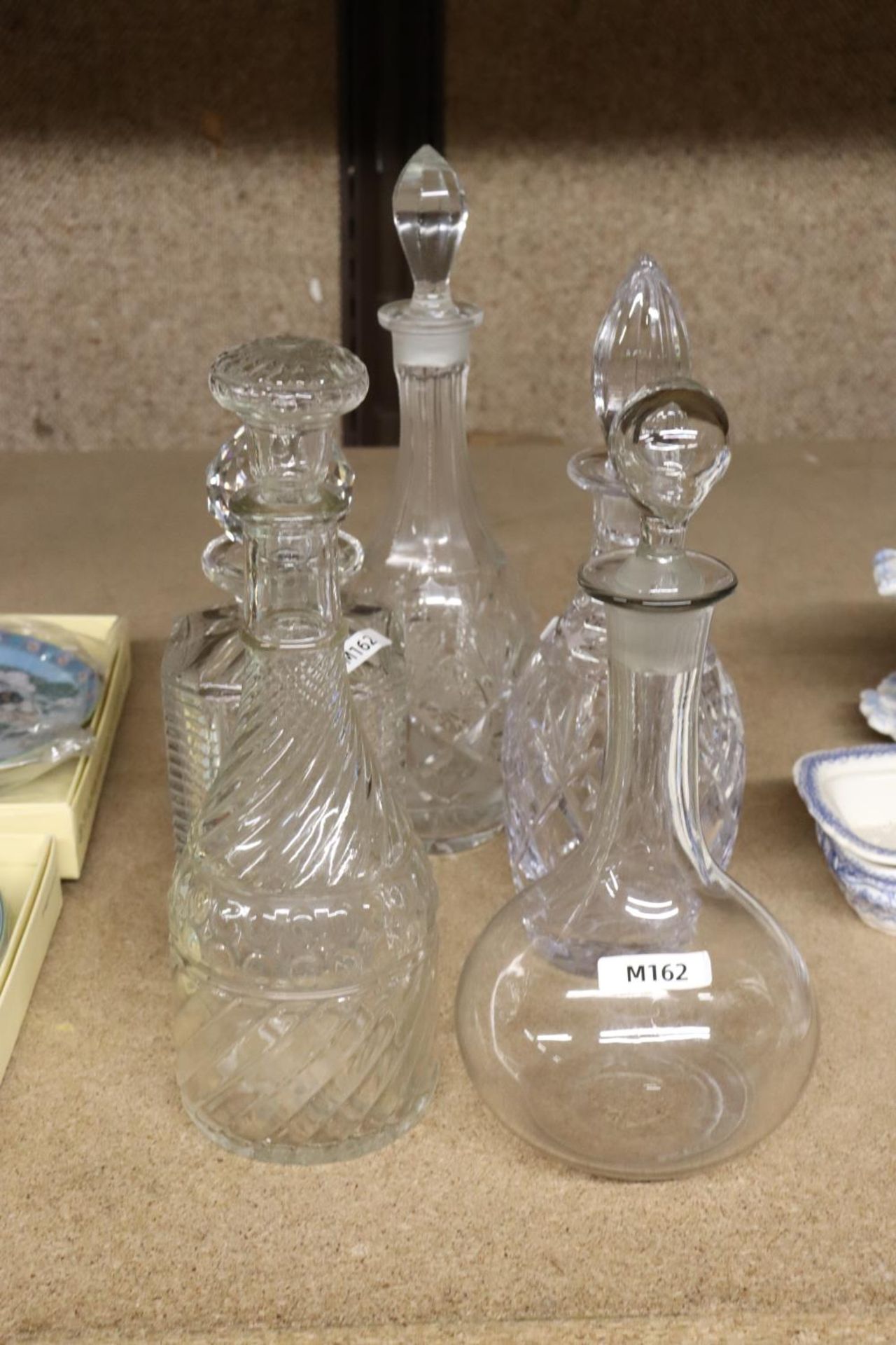 FIVE GLASS DECANTERS