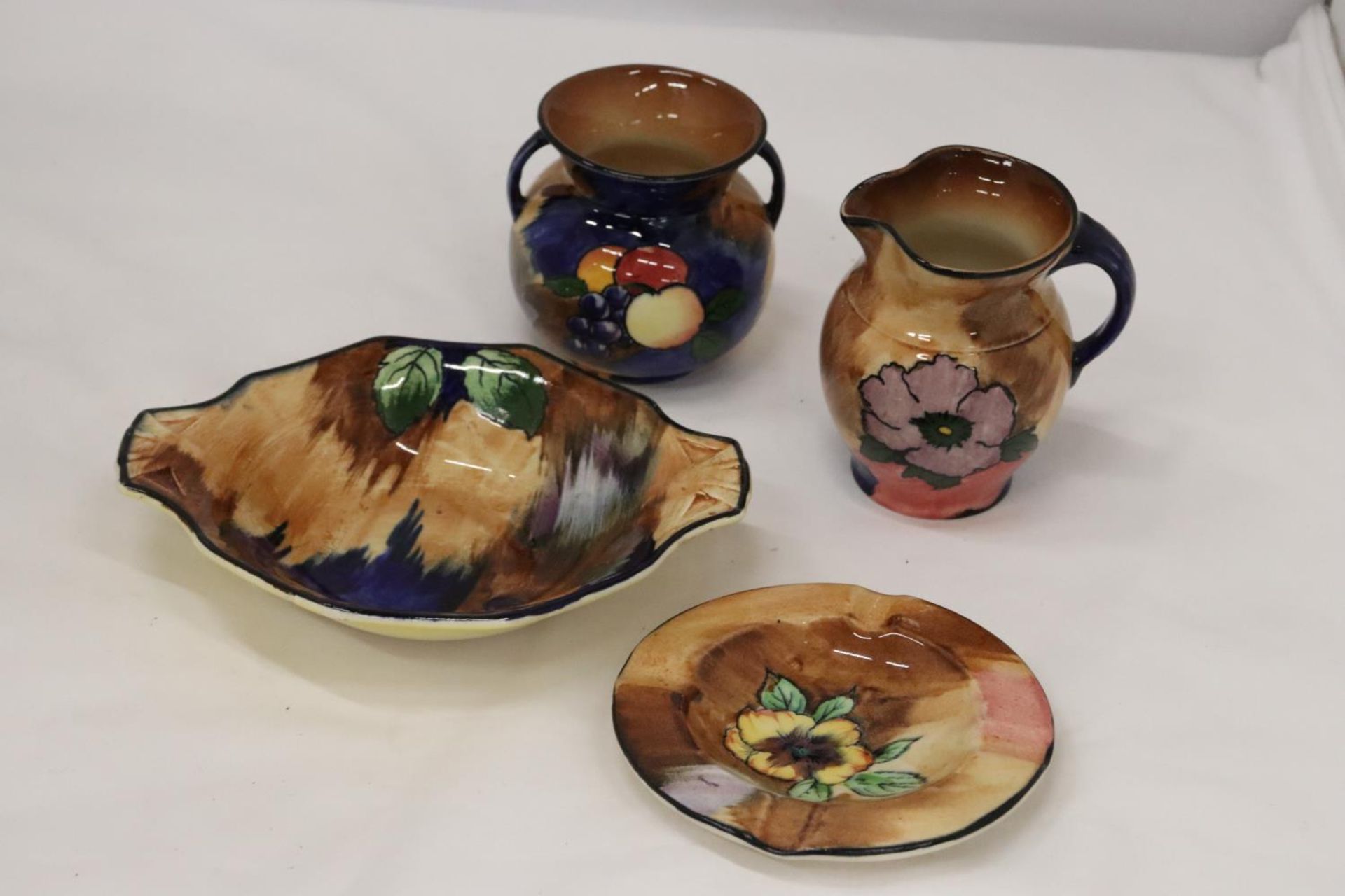 FOUR PIECES OF H & K TUNSTALL POTTERY, TO INCLUDE A BOWL, PLATE, JUG AND BOWL