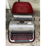 A REMINGTON QUIET-RITER TYPEWRITER WITH CARRY CASE