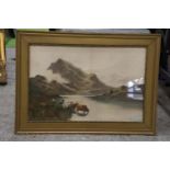 A FRAMED PRINT OF CATTLE, A LAKE AND MOUNTAINS IN A GILT FRAME, 64CM X 46CM
