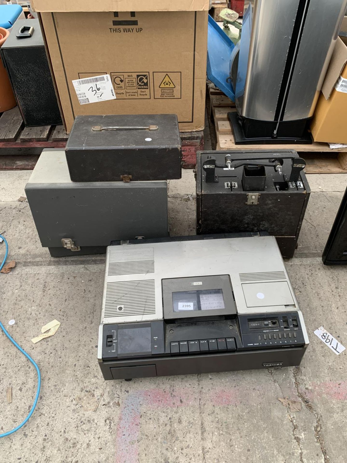 A RETRO TOSHIBA BVIDEO PLAYER AND TWO VINTAGE PROJECTORS