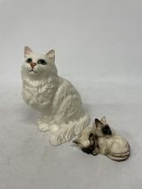 TWO BESWICK CATS TO INCLUDE A LARGE WHITE ONE NO 1867 AND A PAIR OF SIAMESE (EAR A/F)