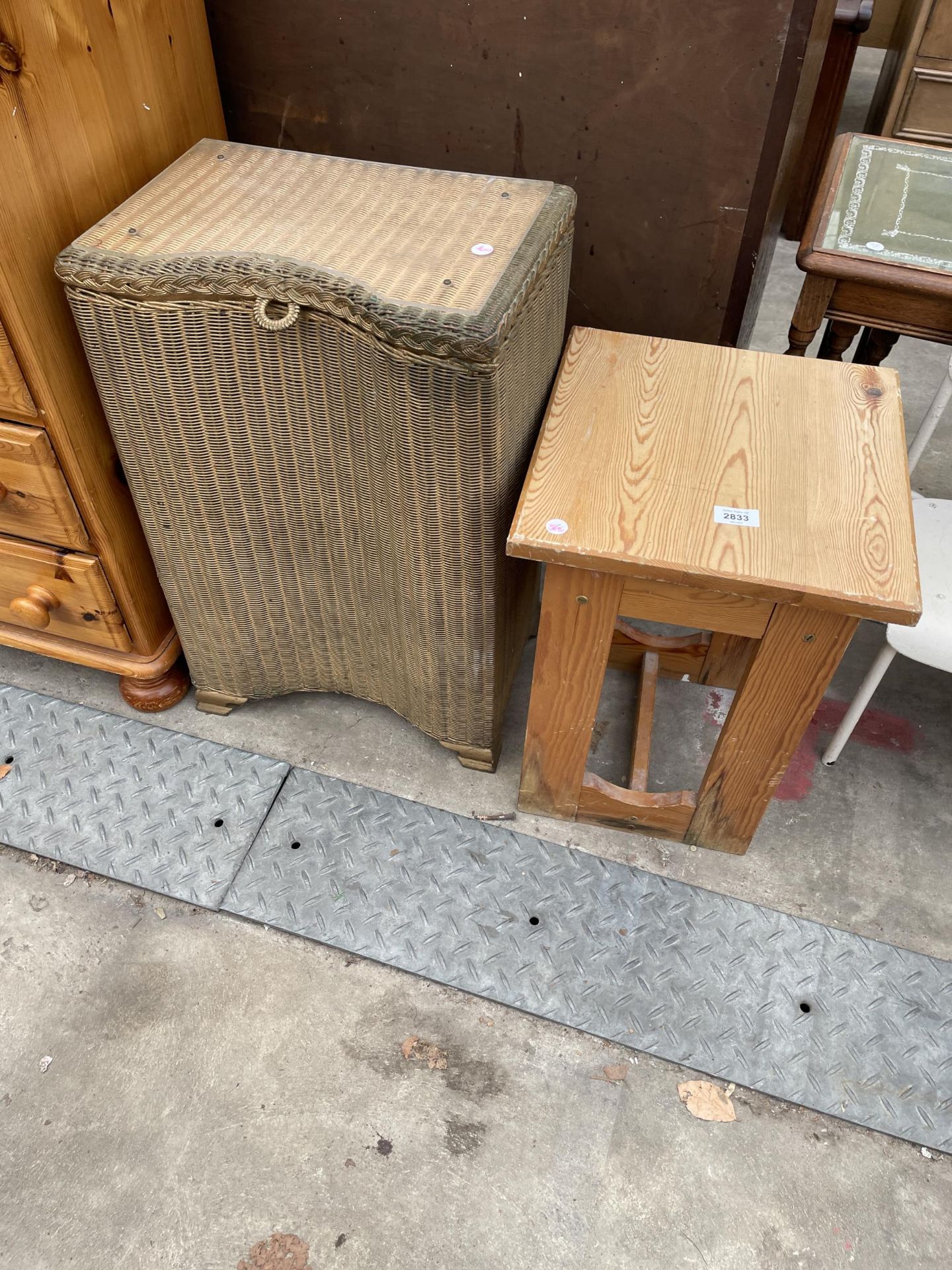 A LLOYD LOOM LINEN BOX AND A SMALL PINE TABLE