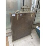 A VINTAGE BRASS AND COPPER FIRE SCREEN