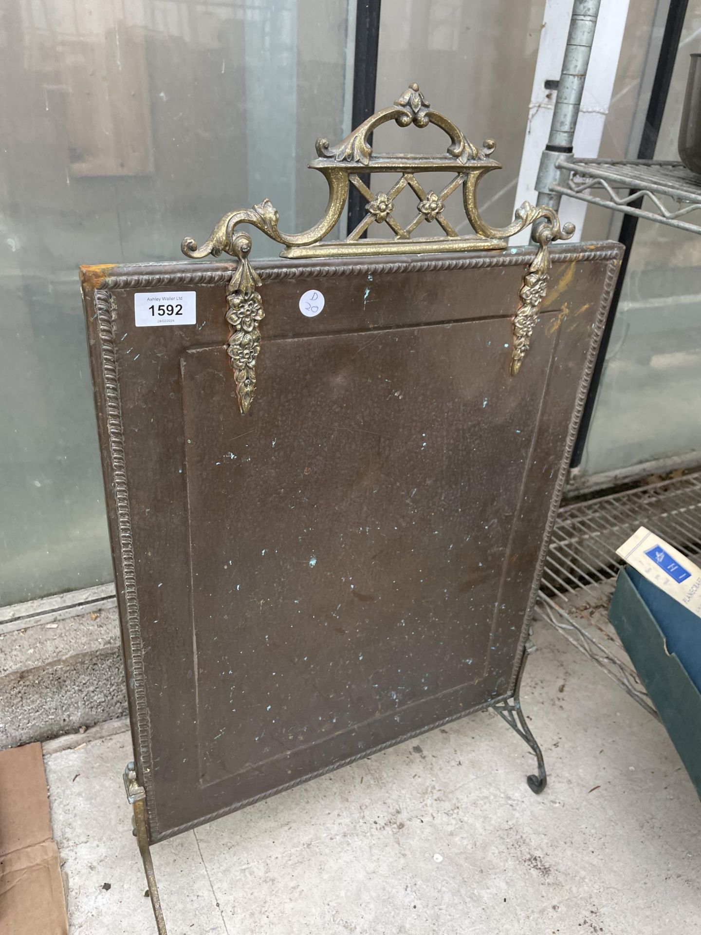 A VINTAGE BRASS AND COPPER FIRE SCREEN