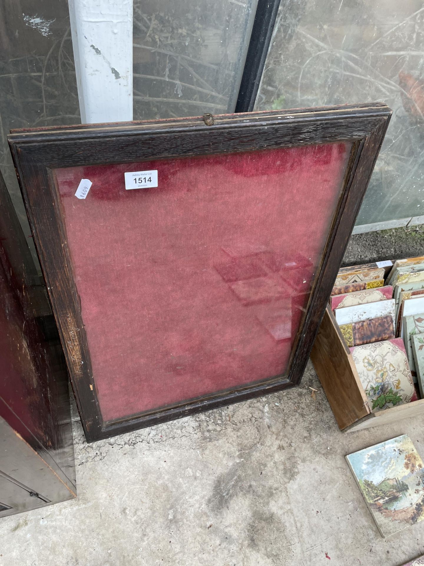 A VINTAGE WOODEN FRAMED GLASS FRONTED DISPLAY BOARD