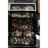 A LARGE MAKEUP CASE CONTAINING COSTUME JEWELLERY