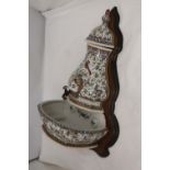 A PORTUGUESE HAND PAINTED WATER FEATURE ON A WOODEN BACK