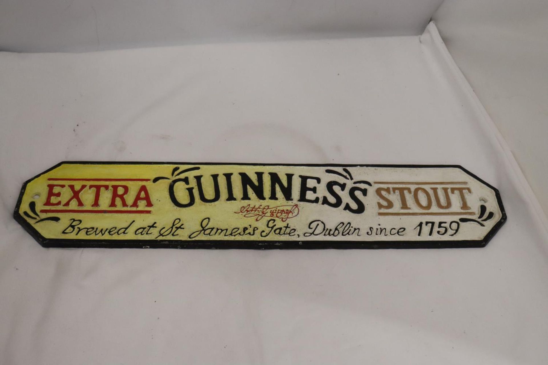 A CAST EXTRA GUINNESS STOUT SIGN