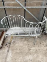 A DECORATIVE METAL BACK TO BACK TWO SEATER LOVE SEAT