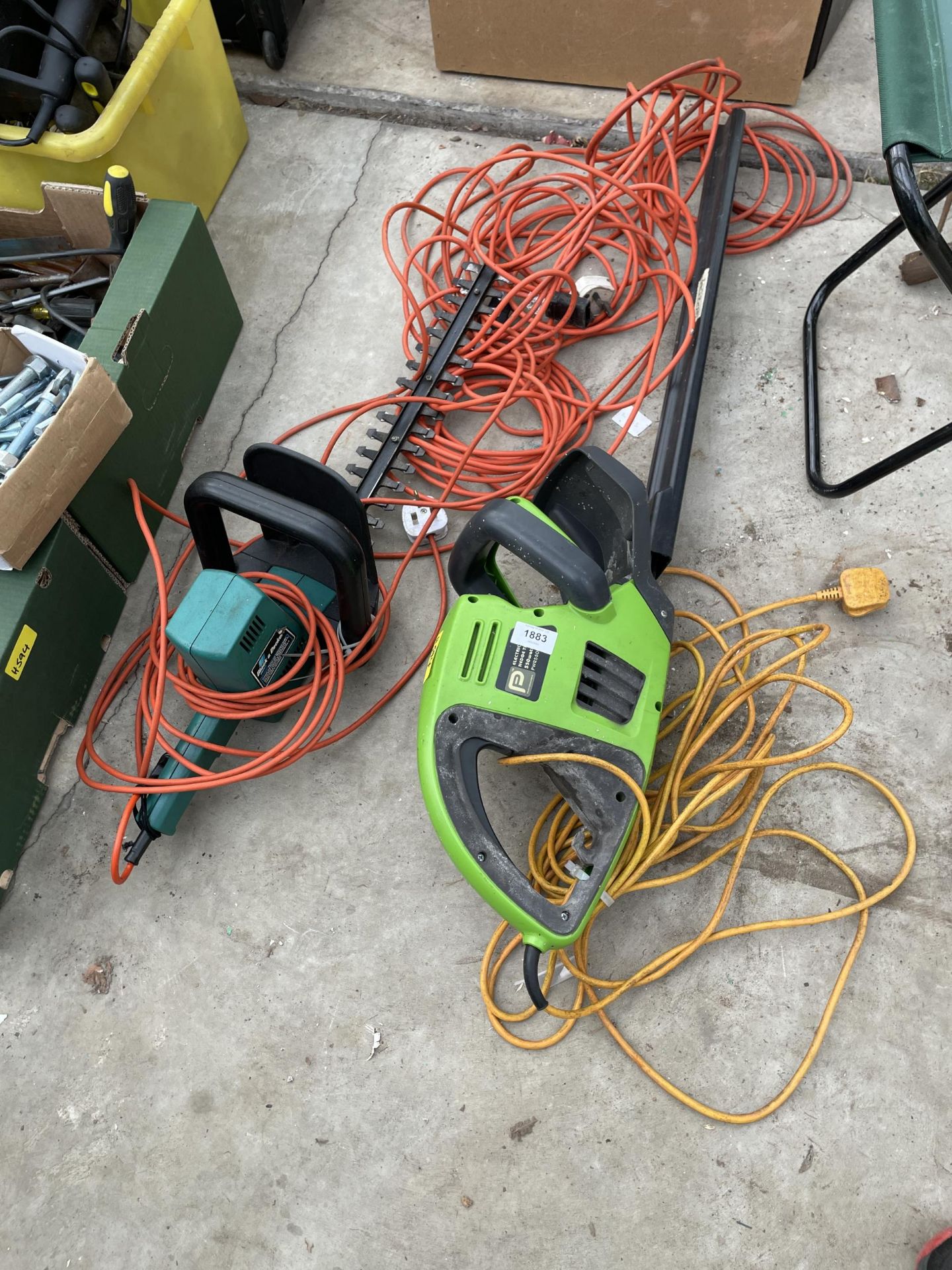 A BLACK AND DECKER ELECTRIC HEDGE TRIMMER AND A FURTHER HEDGE TRIMMER