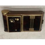 AN ART DECO MUSICAL COMPACT FIG CASE