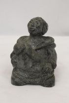 A STONE CRAFT FIGURE OF AN ESKIMO WITH CHILD