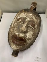 A WEST AFRICAN IGBO TRIBAL MASK FROM NIGERIA