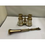 AN ANTIQUE PAIR OF MOTHER OF PEARL OPERA GLASSES WITH A MATCHING HANDLE