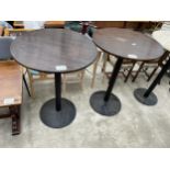 A PAIR OF HIGH PUB TABLES ON METAL WARE COLUMNS 31" DIAMETER