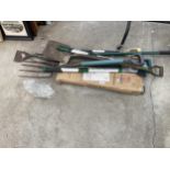AN ASSORTMENT OF TOOLS TO INCLUDE FORKS, A SPADE AND A COLUMN PARKING BARRIER ETC