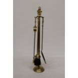 A BRASS COMPANION SET AND STAND WITH GALLEON HANDLES