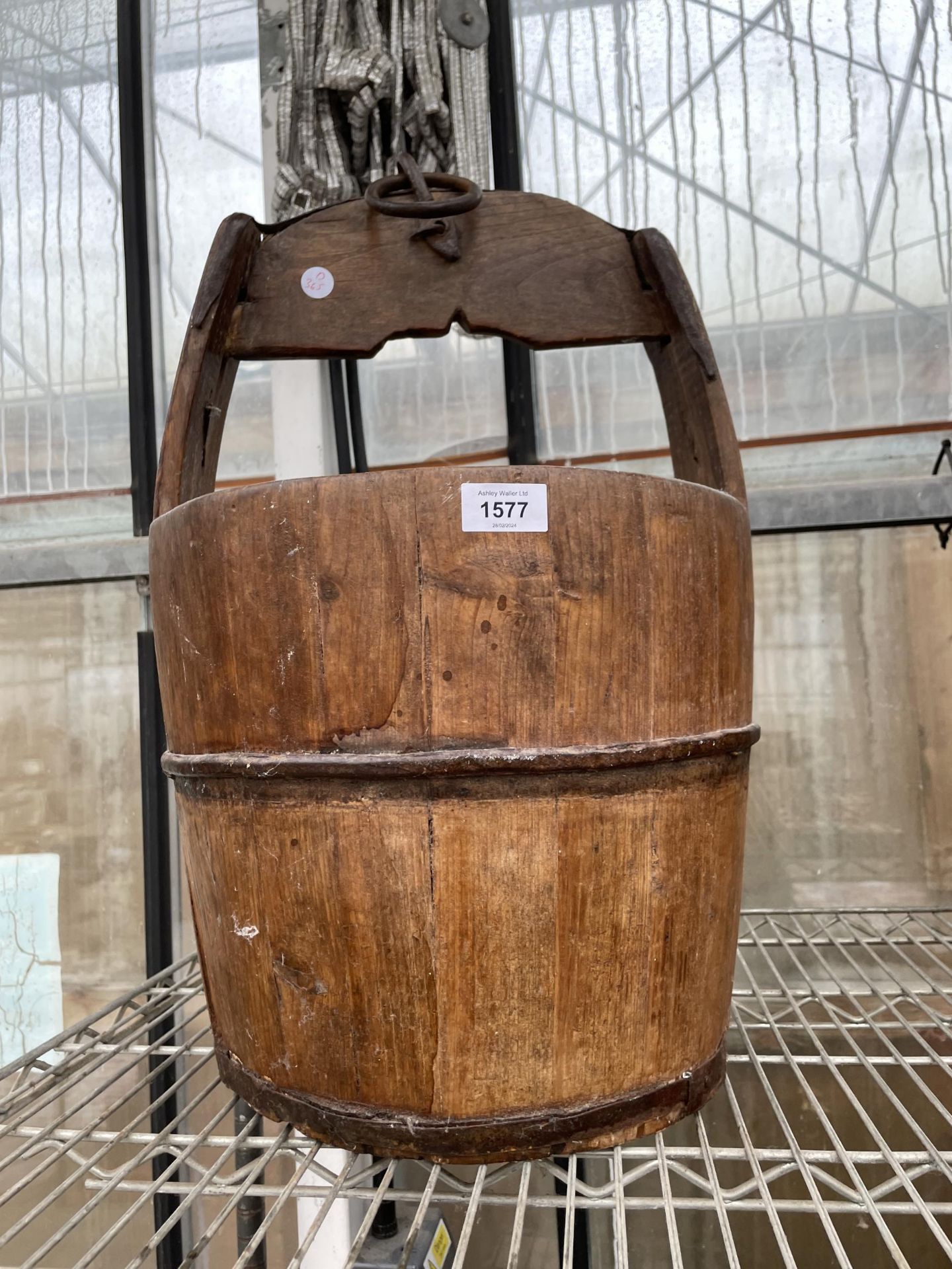 A VINTAGE OAK PAIL BUCKET WITH IRON BANDING AND LOOP