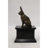 A FIGURE OF A HARE SITTING ON A WOODEN TRINKET BOX