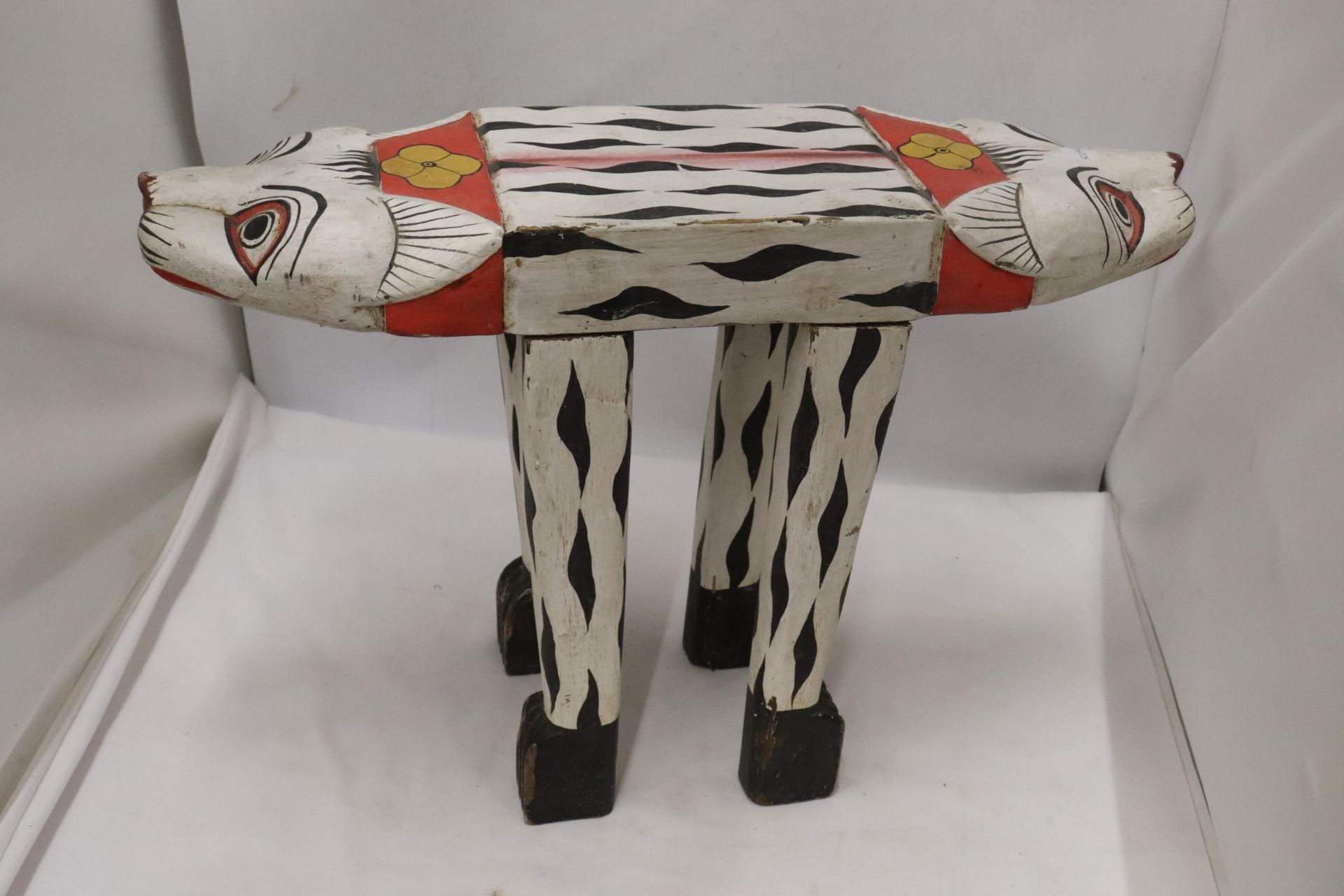 A QUIRKY CHILD'S STOOL IN THE SHAPE OF AN ANIMAL