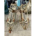 A PAIR OF VINTAGE DECORATIVE METAL WALL LIGHT FITTINGS