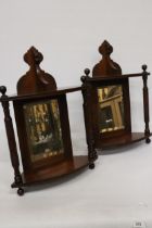A PAIR OF EDWARDIAN MAHOGANY MIRRORED CORNER SHELVES WITH TURNED COLUMNS