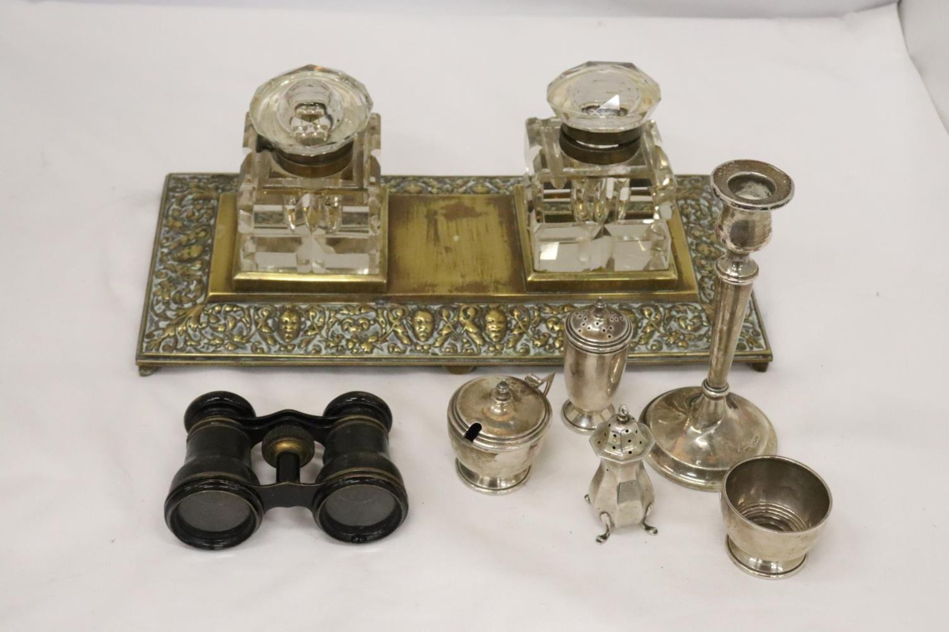 A VINTAGE FOOTED BRASS DOUBLE INK WELL TOGETHER WITH OPERA GLASSES AND VARIOUS SILVER PLATE