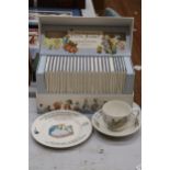 A BOXED 'THE WORLD OF PETER RABBIT' COLLECTION OF BOOKS PLUS THREE PIECES OF WEDGWOOD PETER RABBIT