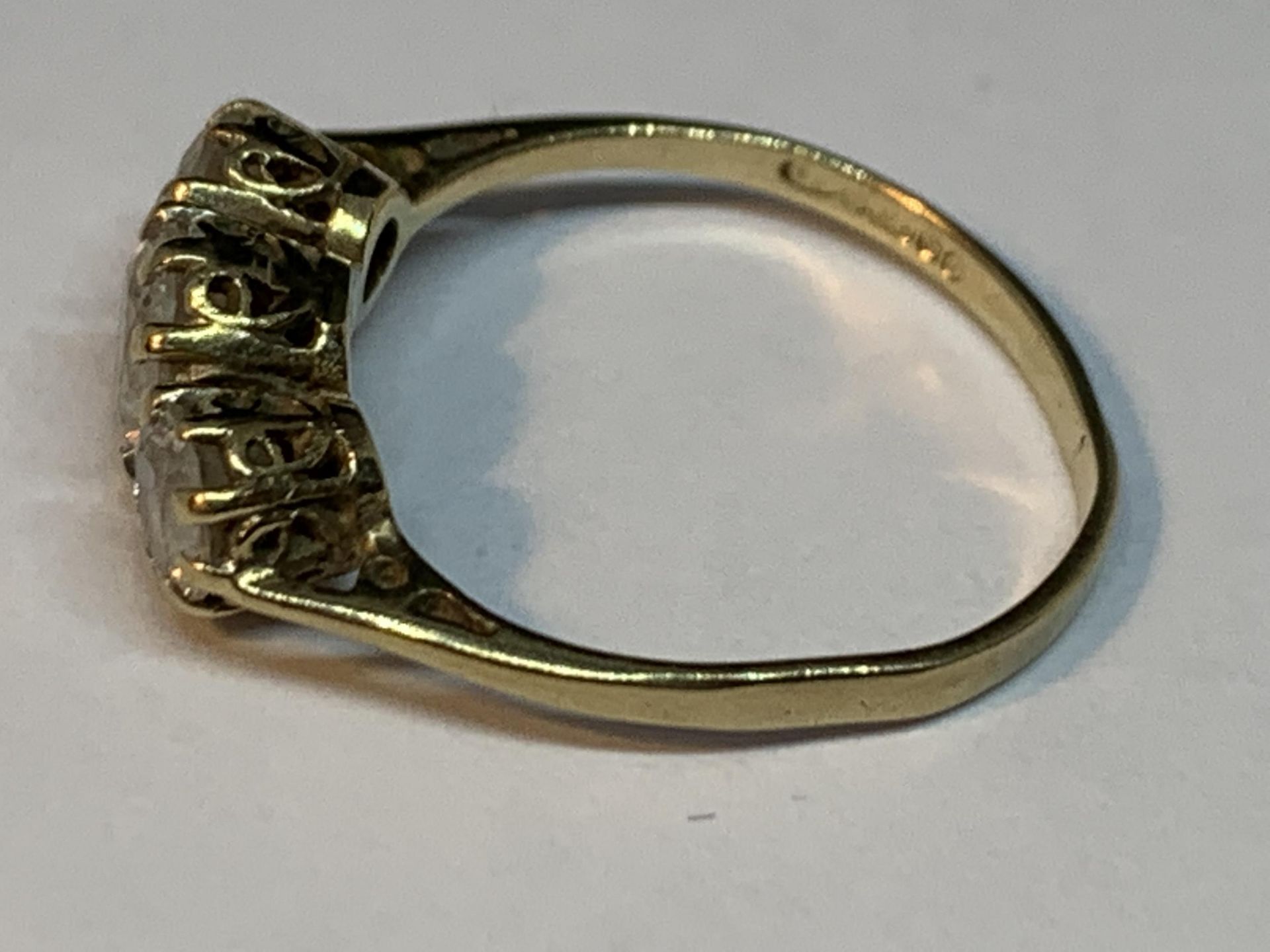 A 9 CARAT GOLD RING WITH THREE IN LINE CUBIC ZIRCONIAS SIZE J/K - Image 2 of 3