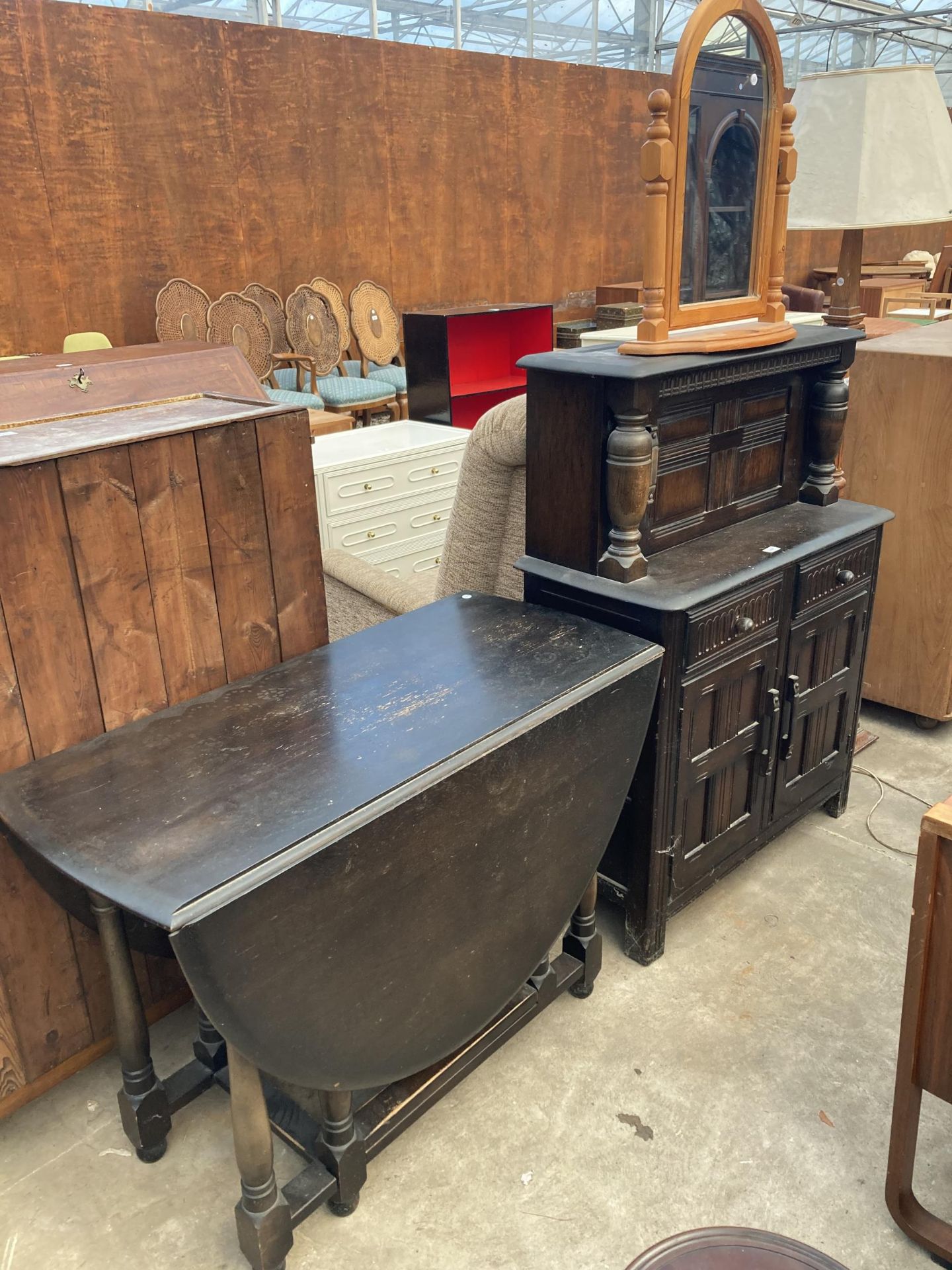 A REPRODUCTION COURT CUPBOARD, GATE LEG DINING TABLE AND PINE DRESSING MIRROR