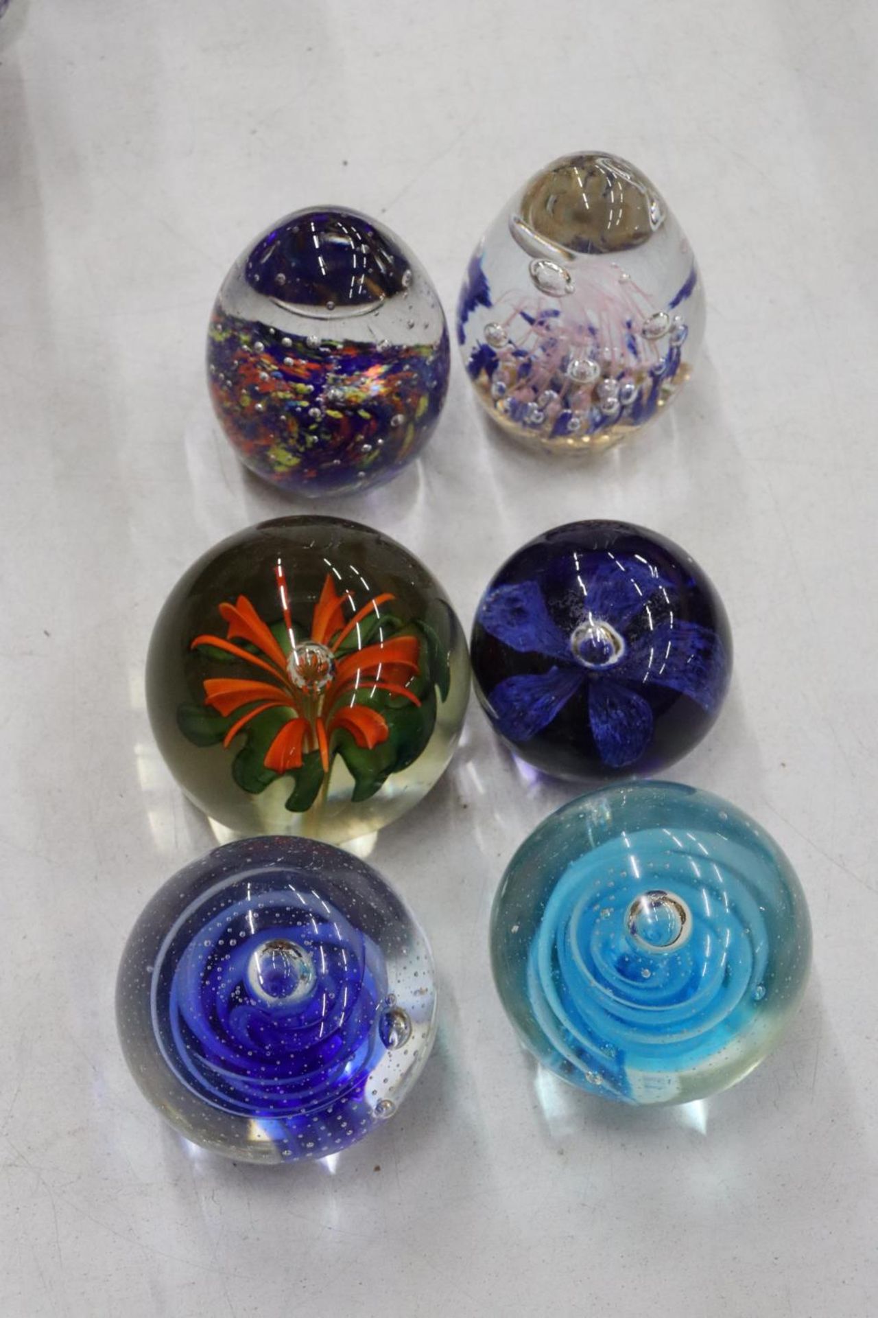 SIX GLASS PAPERWEIGHTS