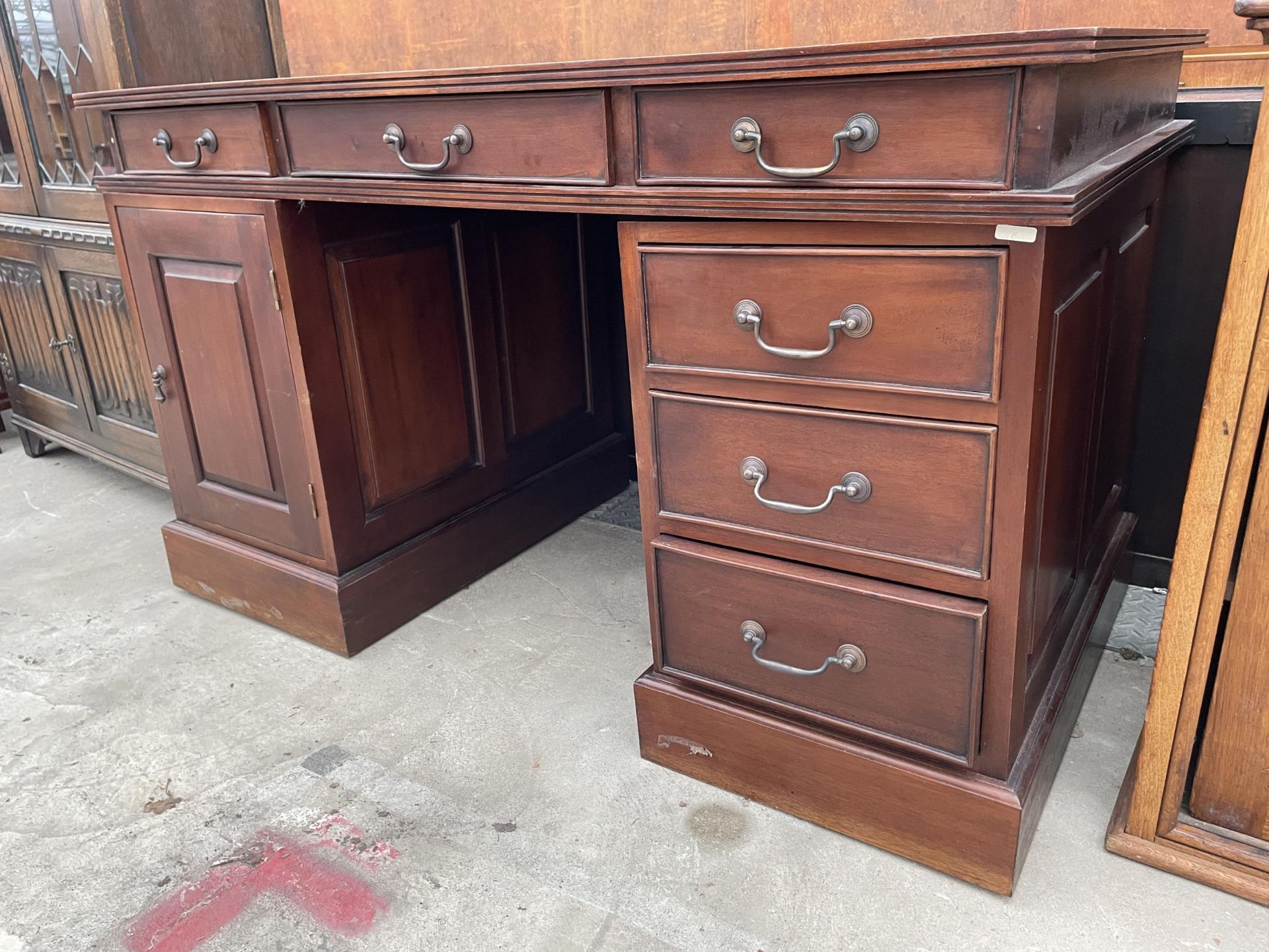 A TWIN PEDESTAL OFFICE DESK ENCLOSING SIX DRAWERS AND ONE CUPBOARD 53" X29" - Image 2 of 5