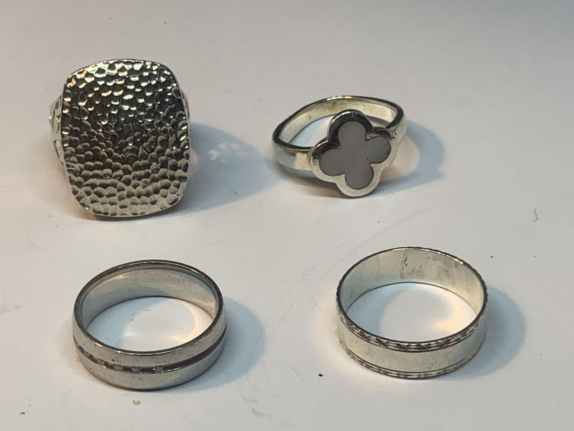 FOUR VARIOUS SILVER RINGS