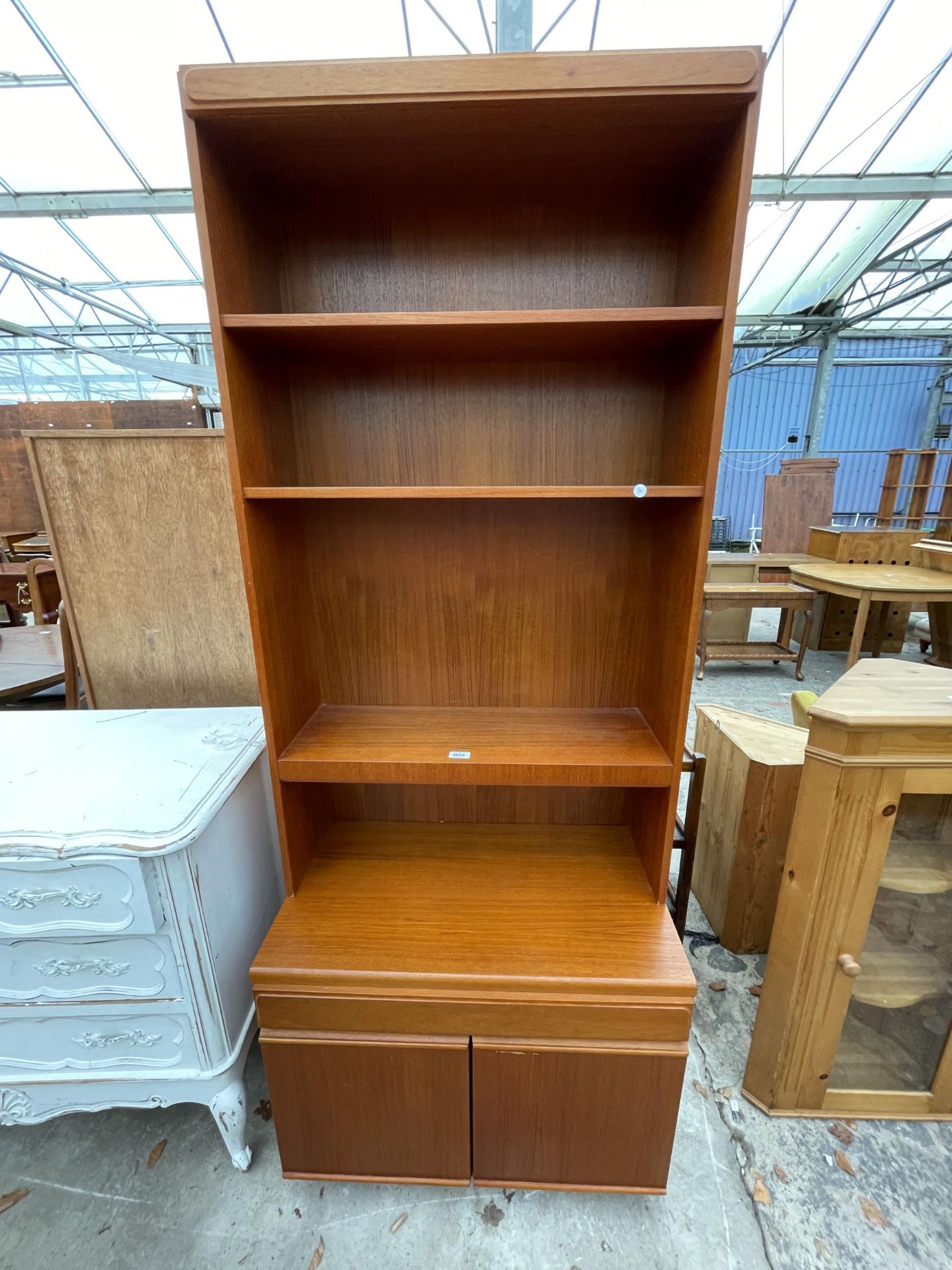 A RETRO TEAK OPEN BOOKCASE WITH CUPBOARDS TO BASE - 30 INCH WIDE