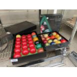 A COMPLETE SET OF SNOOKER BALLS AND A FULL SET OF POOL BALLS