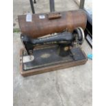 A VINTAGE SINGER SEWING MACHINE WITH CARRY CASE