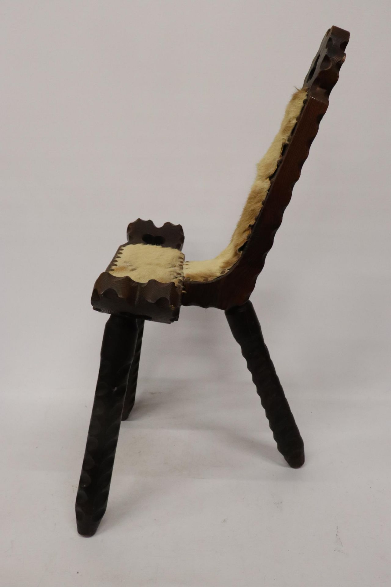 AN AFRICAN ANIMAL HIDE, WOODEN CHAIR - Image 2 of 6