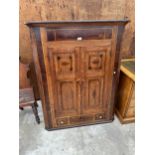 A GEORGE III OAK AND MAHOGANY CORNER CUPBOARD WITH SINGLE DRAWER AND TWO SHAM DRAWERS 40" WIDE