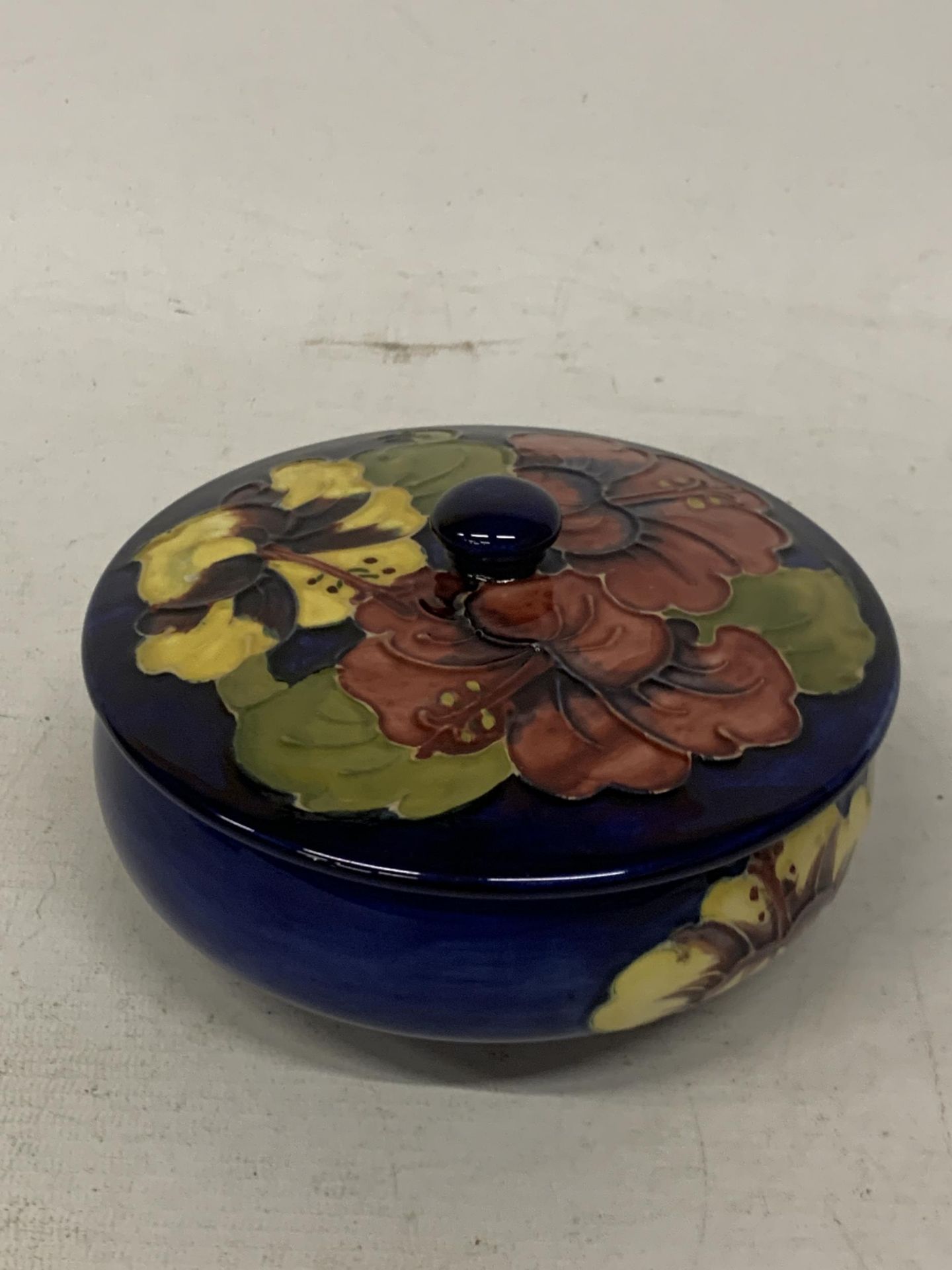 A MOORCROFT BLUE HIBISCUS LIDDED POT