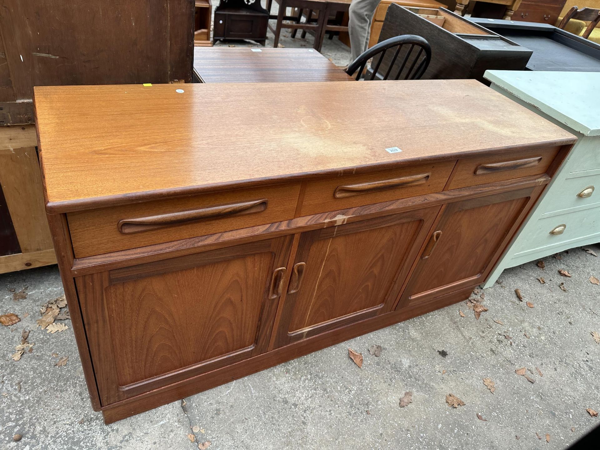 A G PLAN E GOMME RETRO TEAK SIDEBOARD ENCLOSING THREE DRAWERS AND THREE CUPBOARDS 56" WIDE