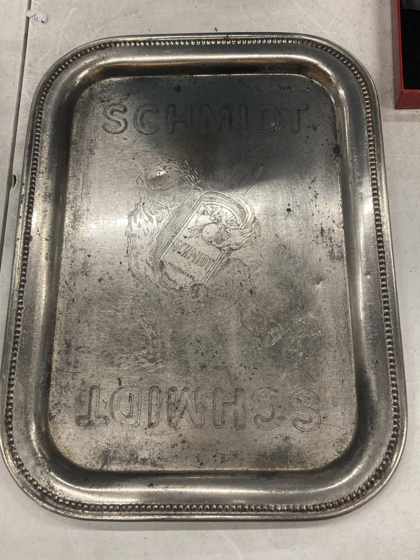 A VINTAGE SCHMIDT BEER TRAY BRUSSELS WITH YETI LOGO