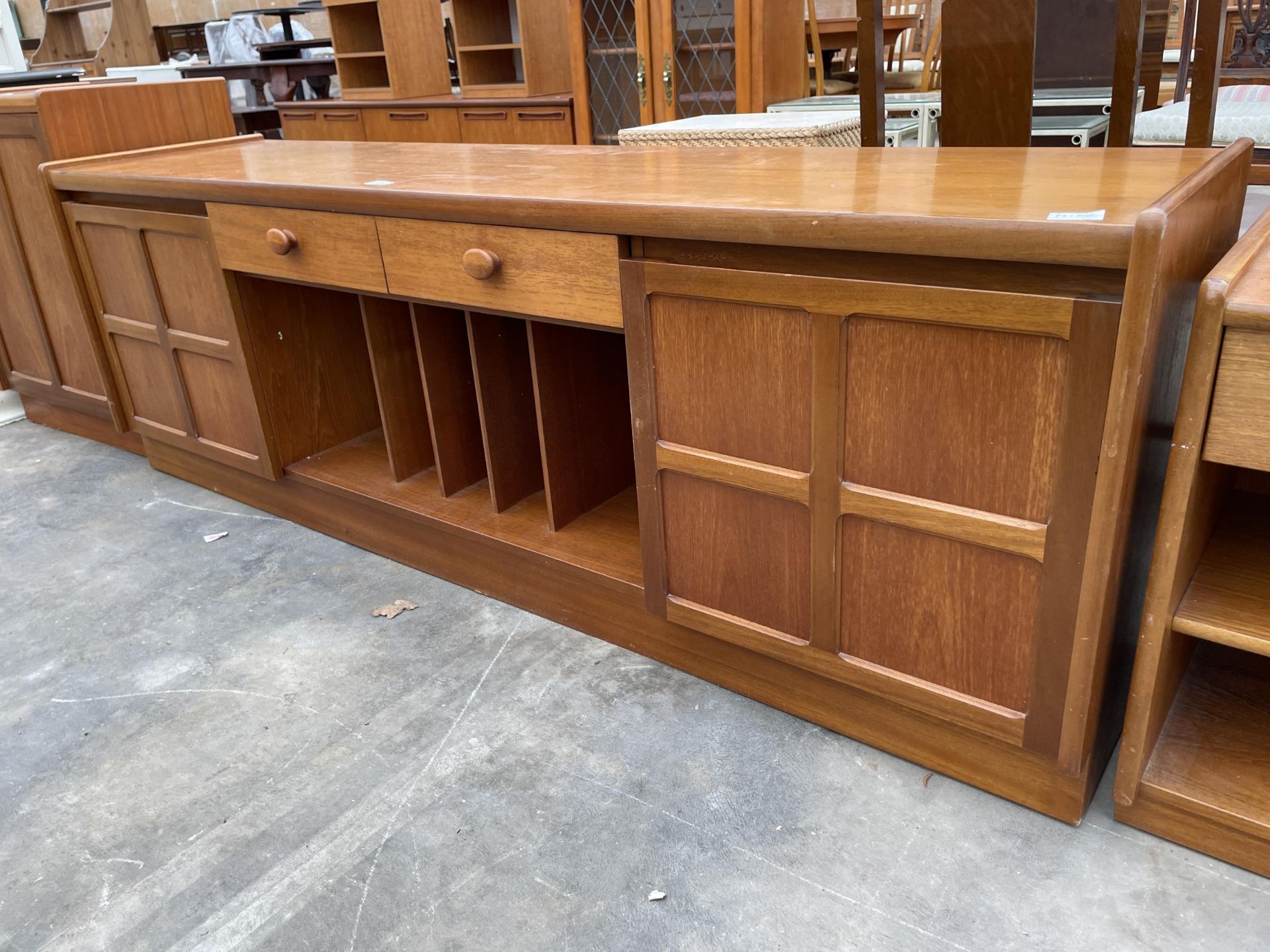 A RETRO TEAK LOW SIDEBOARD ENCLOSING DRAWERS, CUPBOARDS AND RECORD/DOCUMENT RACK - 72 INCH WIDE - Image 2 of 5