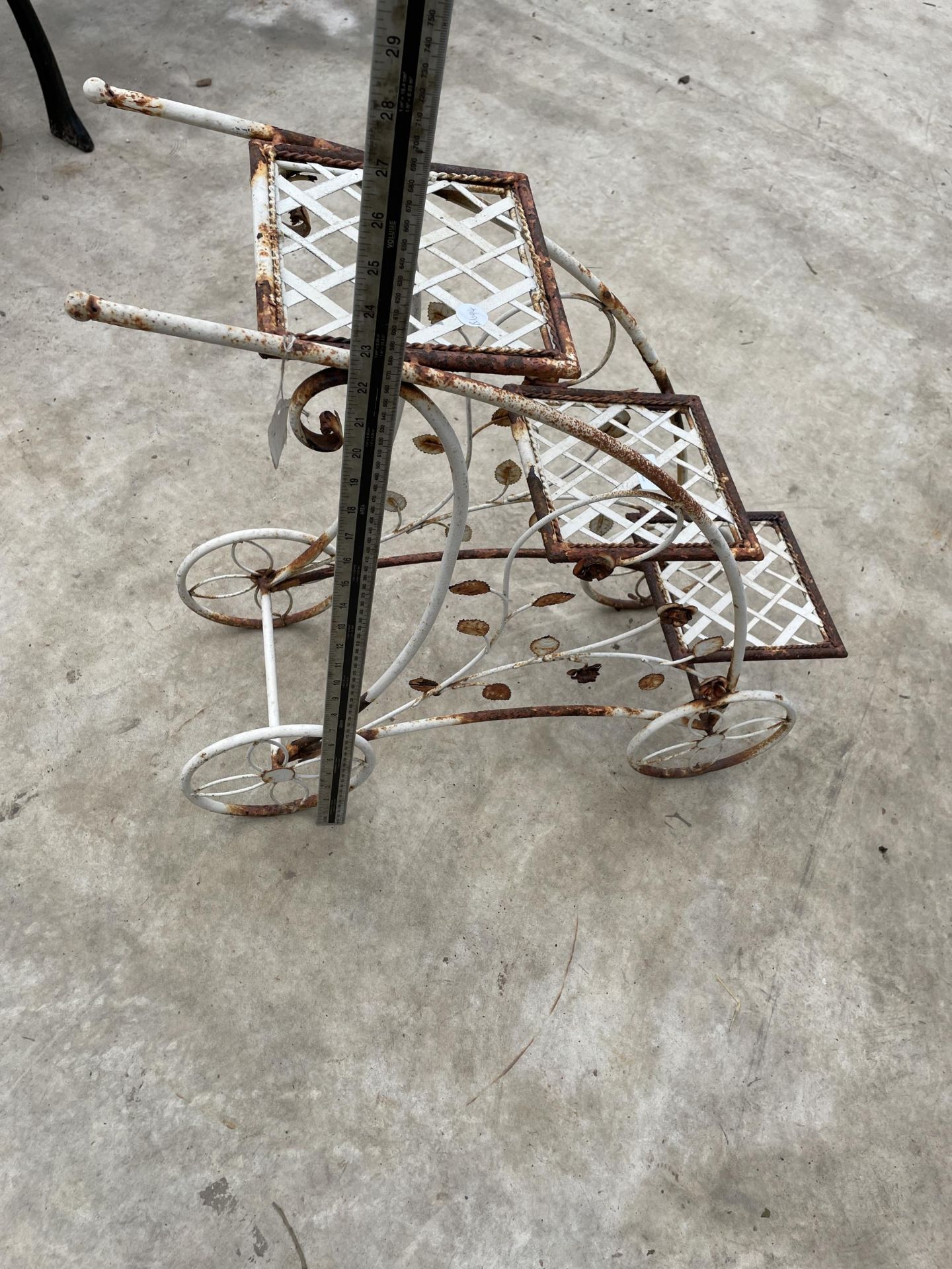 A DECORATIVE METAL THREE TIER PLANT STAND IN THE FORM OF A TROLLEY - Image 4 of 5