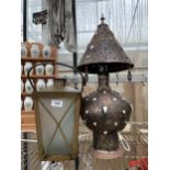 A DECORATIVE TABLE LAMP AND A LANTERN