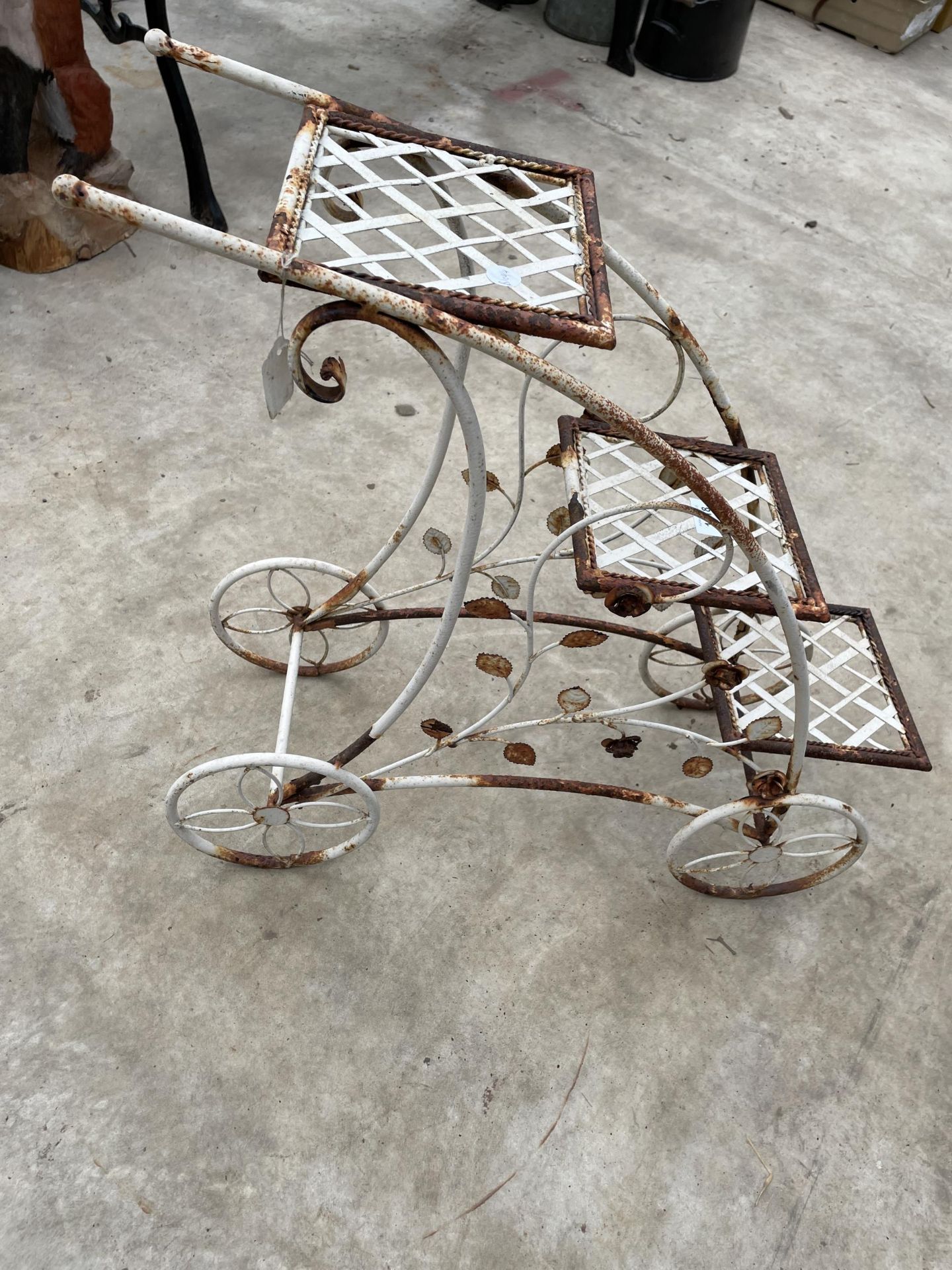 A DECORATIVE METAL THREE TIER PLANT STAND IN THE FORM OF A TROLLEY - Image 3 of 5