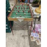 A SMALL VINTAGE FOLDING TABLE FOOTBALL GAME