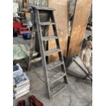 A VINTAGE SIX RUNG WOODEN STEP LADDER